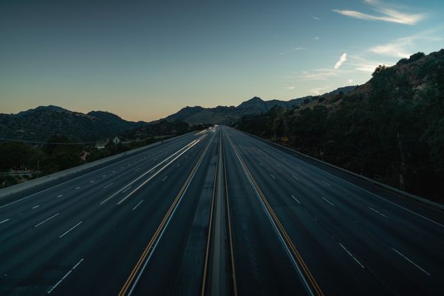 serene%20aerial%20view%20of%20an%20empty%20mountainous%20highway serene%20aerial%20view%20of%20an%20empty%20mountainous%20highway